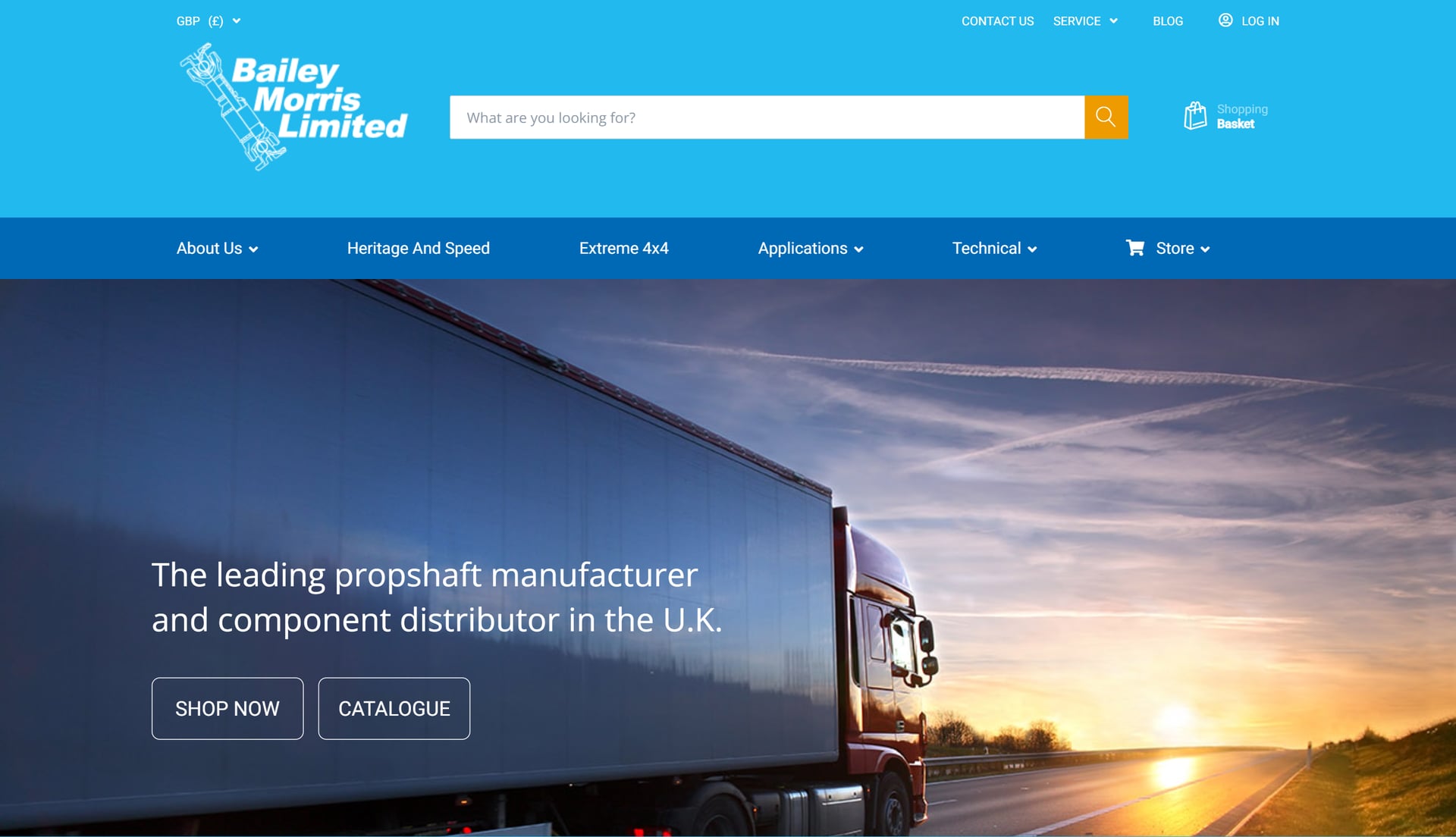 Bailey Morris's previous website — a light-blue header with a cursive 'Bailey Morris Limited' logo, a prominent search bar, a stock photograph of a commercial truck on a sunset road, the headline 'The leading propshaft manufacturer and component distributor in the U.K.', and two CTAs labelled 'Shop Now' and 'Catalogue'.